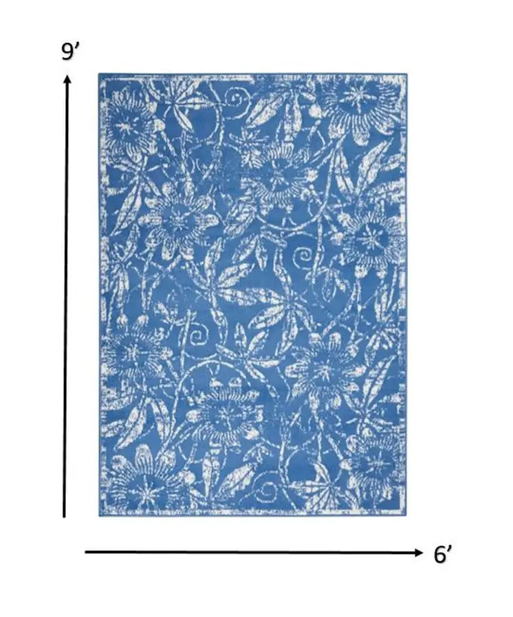 6' X 9' Blue And Ivory Floral Distressed Area Rug
