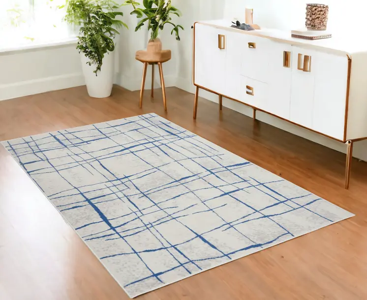 4' X 6' Ivory And Blue Geometric Distressed Area Rug
