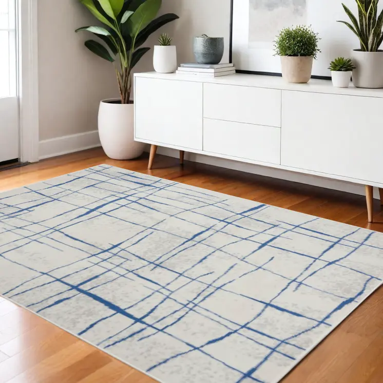 4' X 6' Ivory And Blue Geometric Distressed Area Rug