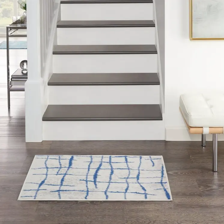 5' X 7' Ivory And Blue Geometric Distressed Area Rug