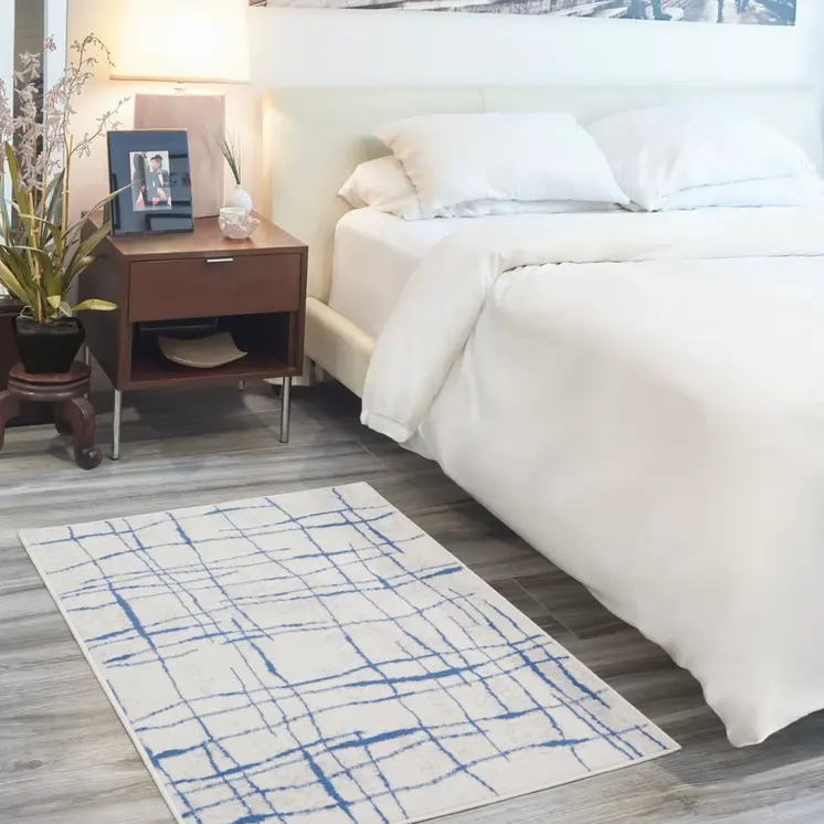5' X 7' Ivory And Blue Geometric Distressed Area Rug