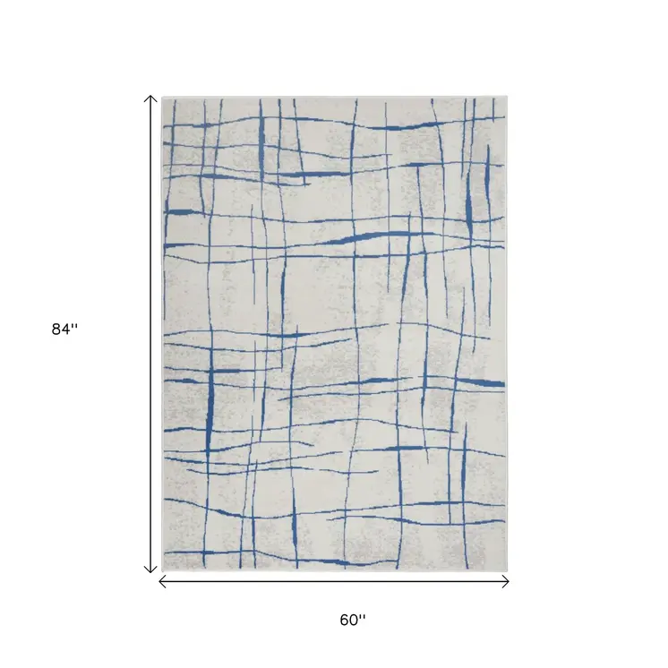 5' X 7' Ivory And Blue Geometric Distressed Area Rug
