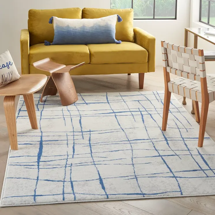 5' X 7' Ivory And Blue Geometric Distressed Area Rug