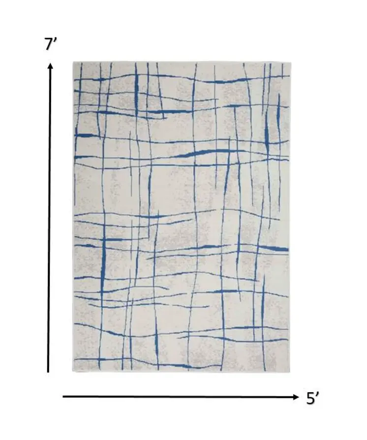 5' X 7' Ivory And Blue Geometric Distressed Area Rug