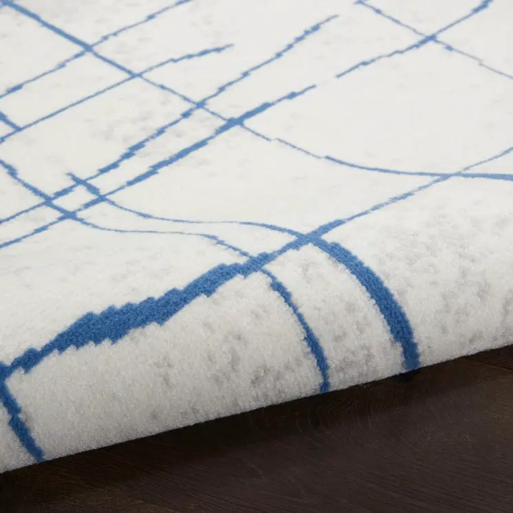 5' X 7' Ivory And Blue Geometric Distressed Area Rug