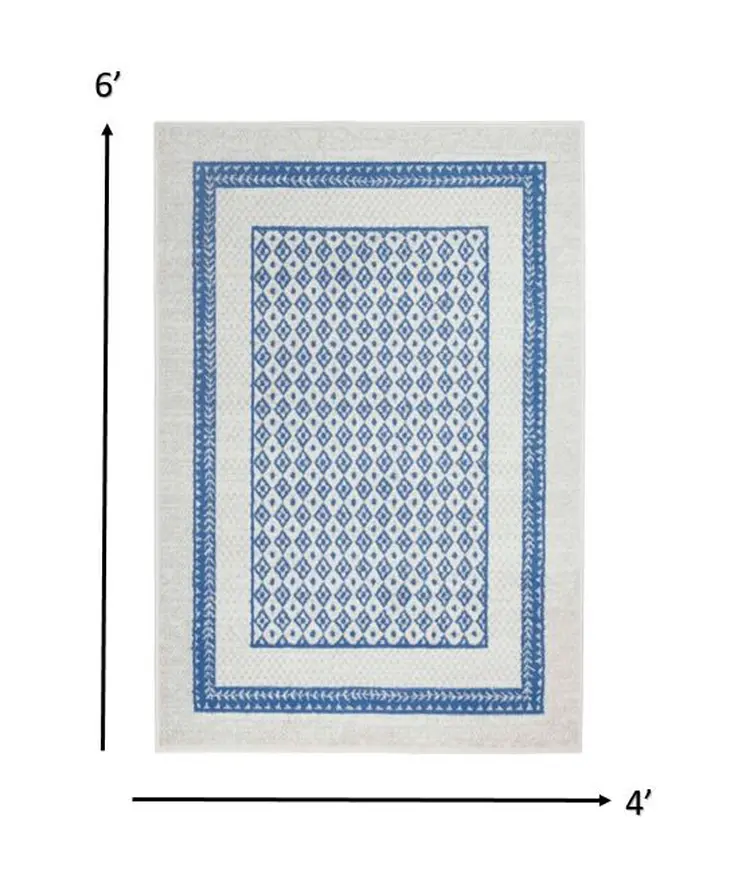 4' X 6' Ivory And Blue Geometric Area Rug