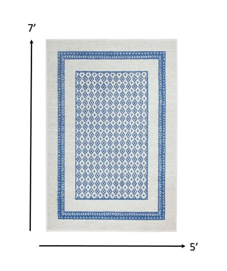 5' X 7' Ivory And Blue Geometric Area Rug