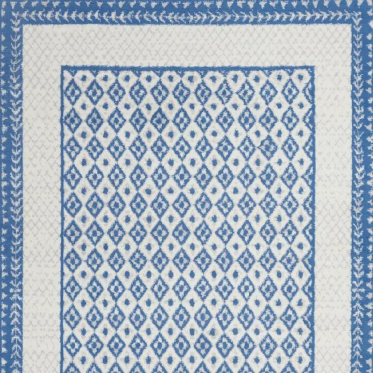 6' X 9' Ivory And Blue Geometric Area Rug