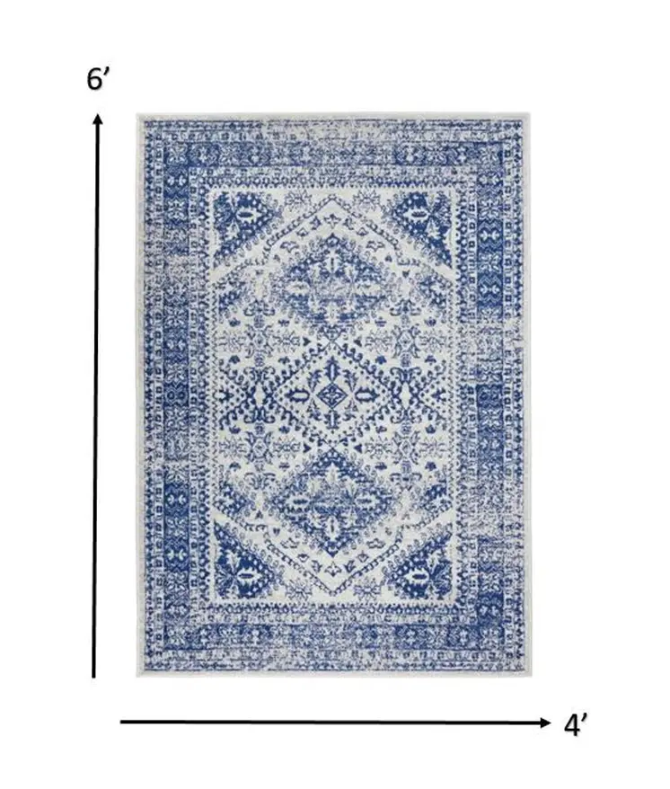 4' X 6' Ivory And Blue Geometric Distressed Area Rug