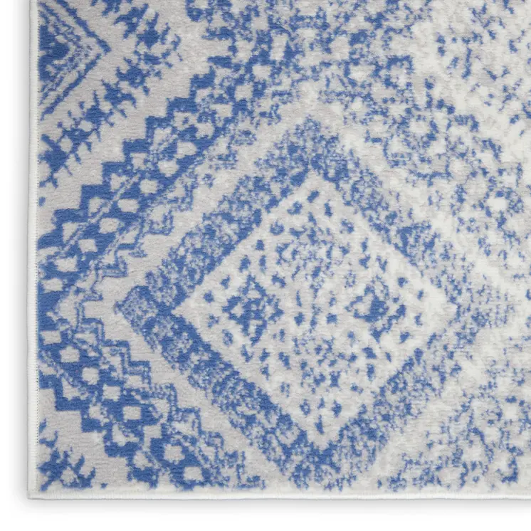 5' X 7' Ivory And Blue Geometric Area Rug