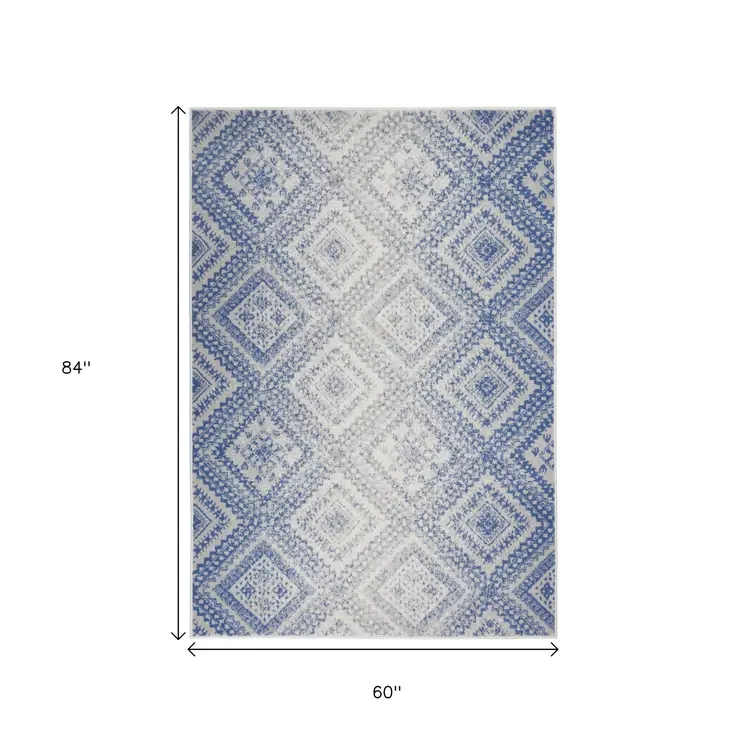 5' X 7' Ivory And Blue Geometric Area Rug