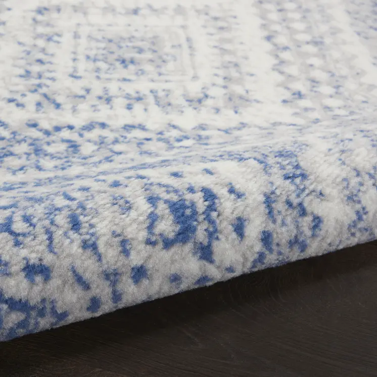 6' X 9' Ivory And Blue Geometric Area Rug