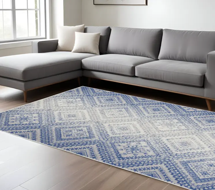 6' X 9' Ivory And Blue Geometric Area Rug