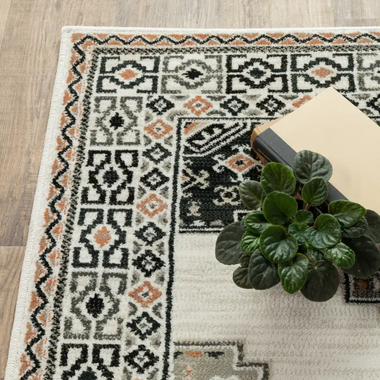 4' X 6' Ivory Black Orange And Gray Geometric Area Rug