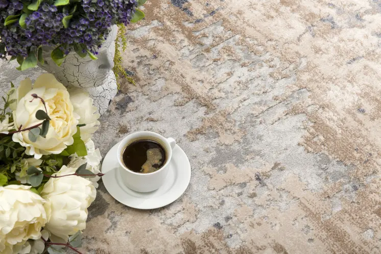 5' X 8' Beige And Ivory Abstract Area Rug
