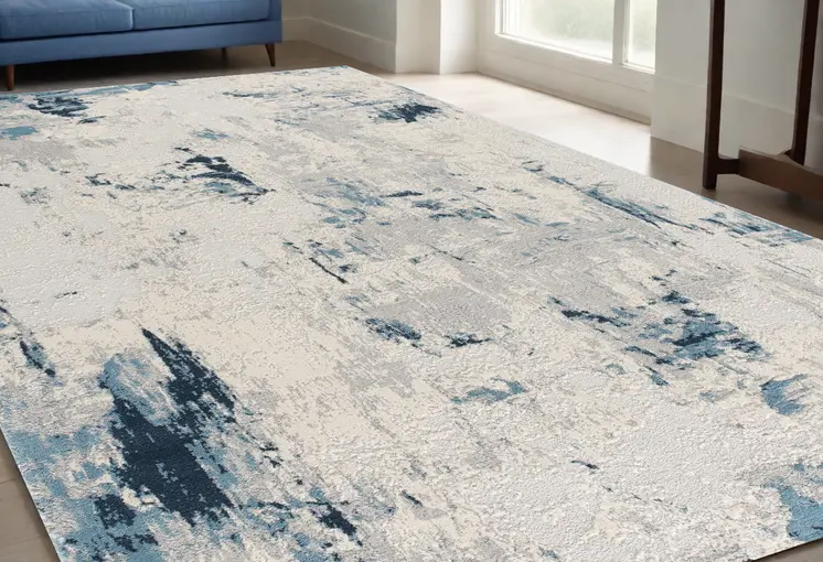 5' X 8' Blue And Ivory Abstract Strokes Area Rug