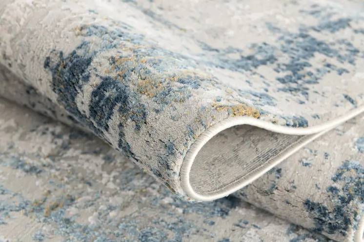 5' X 7' Blue and Ivory Abstract Area Rug