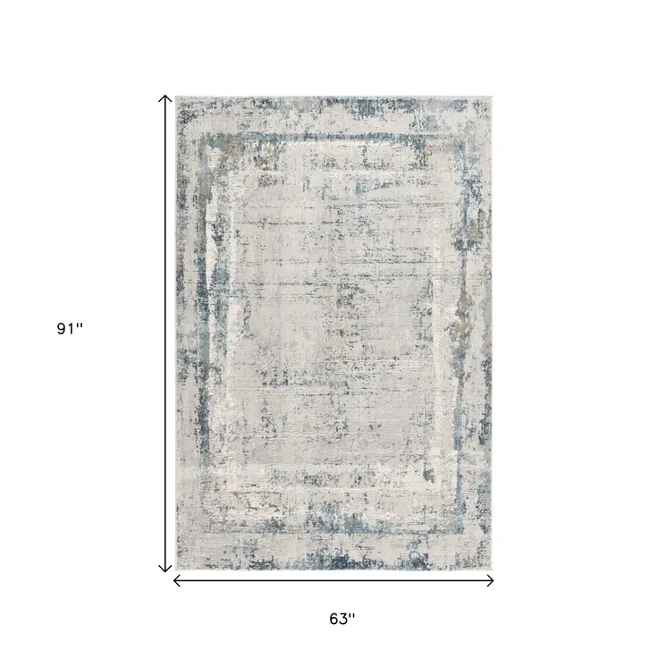 5' X 7' Blue and Ivory Abstract Area Rug
