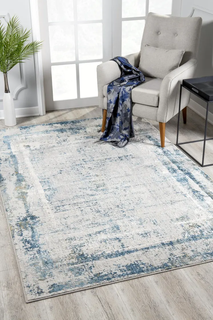 5' X 7' Blue and Ivory Abstract Area Rug