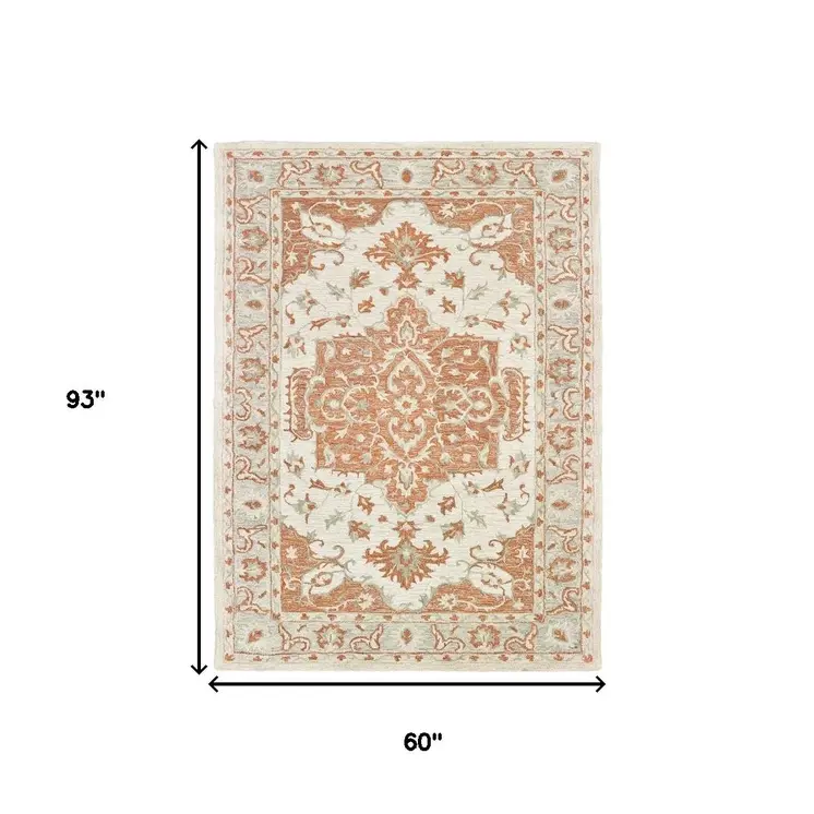 5' X 8' Orange and Ivory Medallion Area Rug