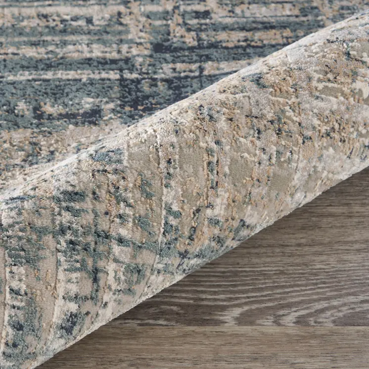5' X 8' Cream Blue And Ivory Geometric Distressed Stain Resistant Area Rug