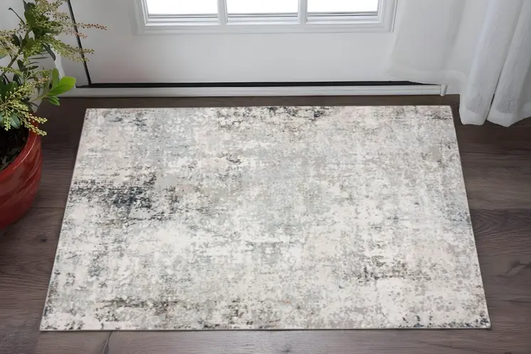 2' X 3' Gray Cream And Taupe Abstract Distressed Stain Resistant Area Rug