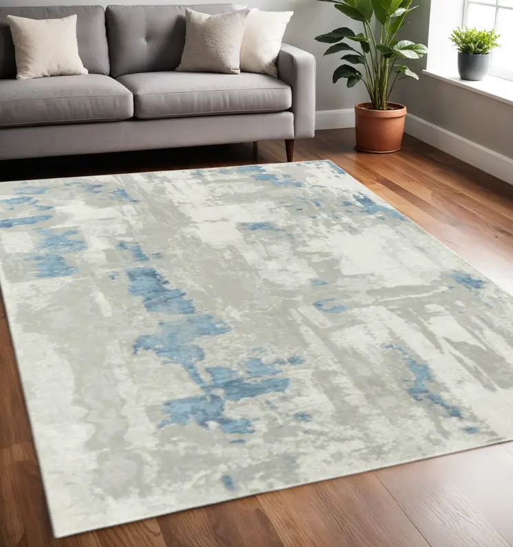 5' X 8' Ivory Gray And Blue Abstract Power Loom Stain Resistant Area Rug