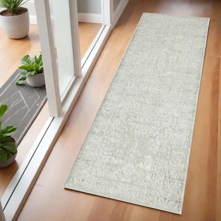 2' X 6' Ivory And Gray Floral Stain Resistant Area Rug