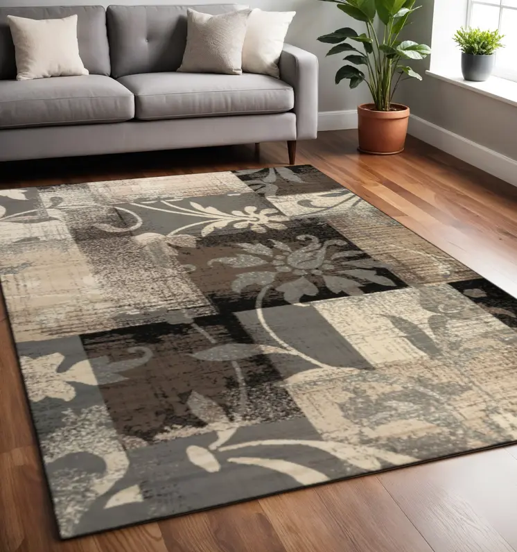 5' X 8' Beige And Gray Floral Power Loom Distressed Stain Resistant Area Rug