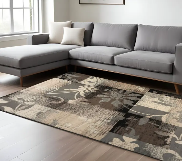 7' X 9' Beige And Gray Floral Power Loom Distressed Stain Resistant Area Rug
