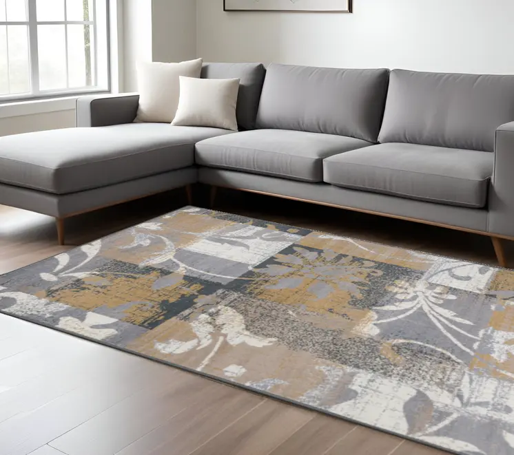 7' X 9' Beige And Gray Floral Power Loom Distressed Stain Resistant Area Rug