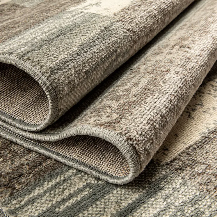 10' Light Blue And Ivory Patchwork Power Loom Stain Resistant Runner Rug