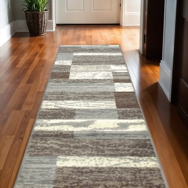 10' Light Blue And Ivory Patchwork Power Loom Stain Resistant Runner Rug