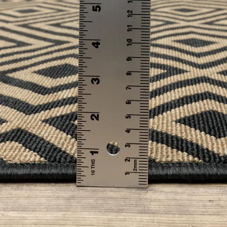 8' X 8' Black and Tan Round Geometric Stain Resistant Indoor Outdoor Area Rug
