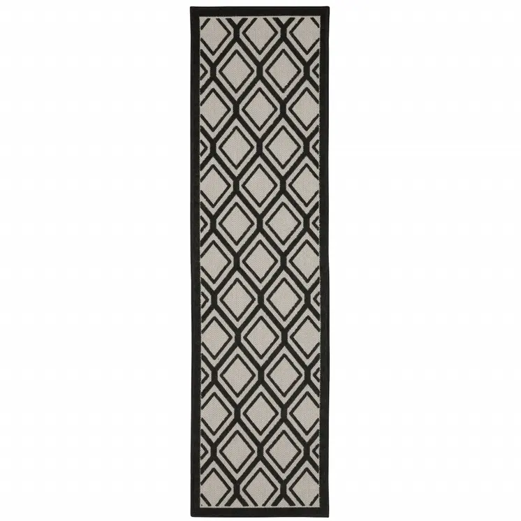 2' X 7' Beige and Black Geometric Stain Resistant Indoor Outdoor Area Rug