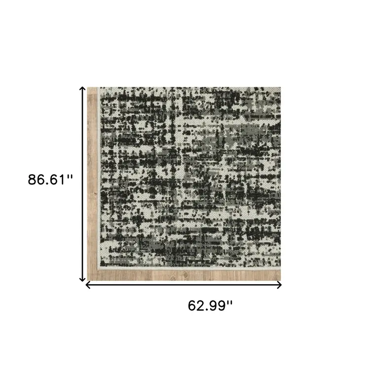 5' X 7' Beige and Black Abstract Stain Resistant Indoor Outdoor Area Rug