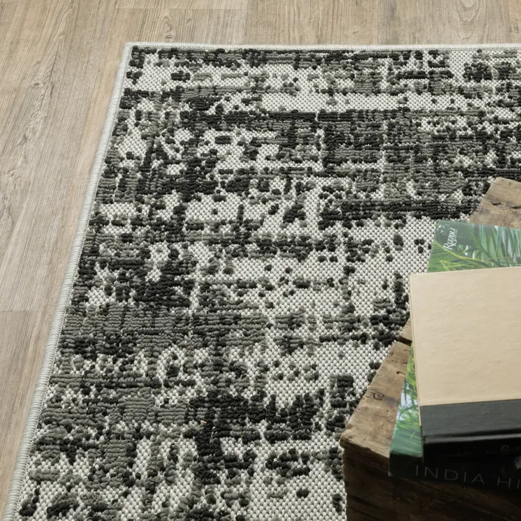 5' X 7' Beige and Black Abstract Stain Resistant Indoor Outdoor Area Rug