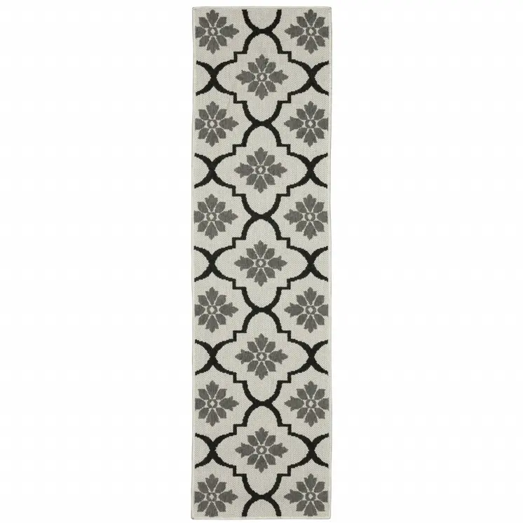 2' X 7' Beige and Black Geometric Stain Resistant Indoor Outdoor Area Rug