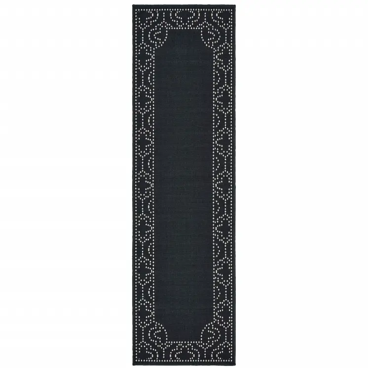 2' X 8' Black and Ivory Stain Resistant Indoor Outdoor Area Rug