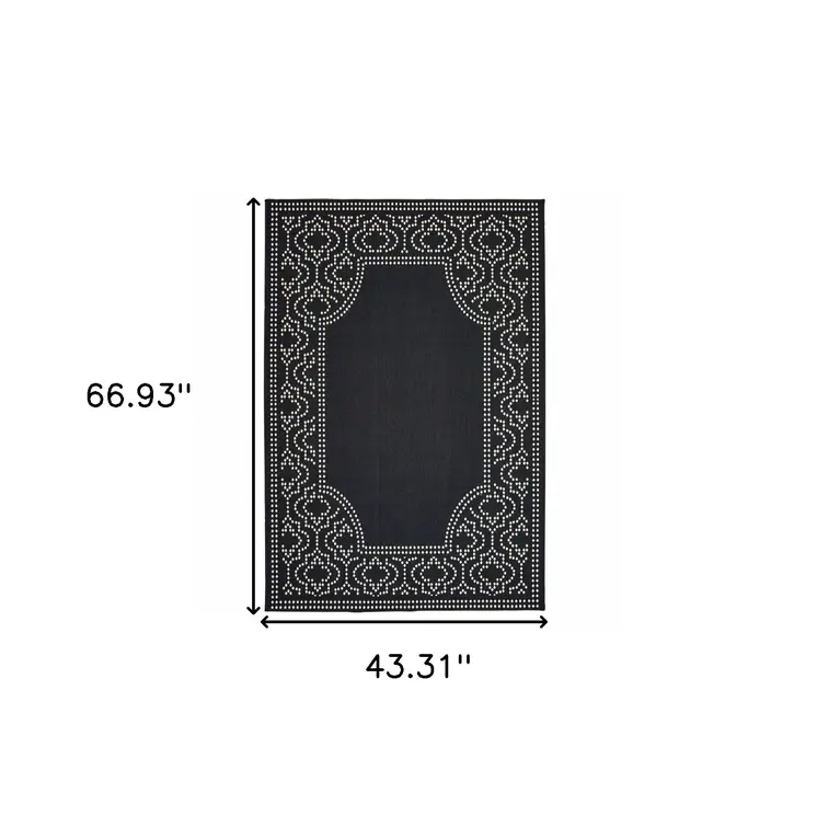 4' X 6' Black and Ivory Stain Resistant Indoor Outdoor Area Rug