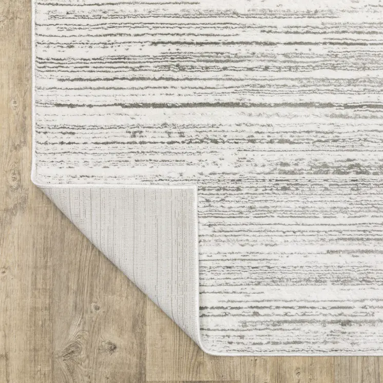 7' X 10' White And Gray Abstract Distressed Area Rug