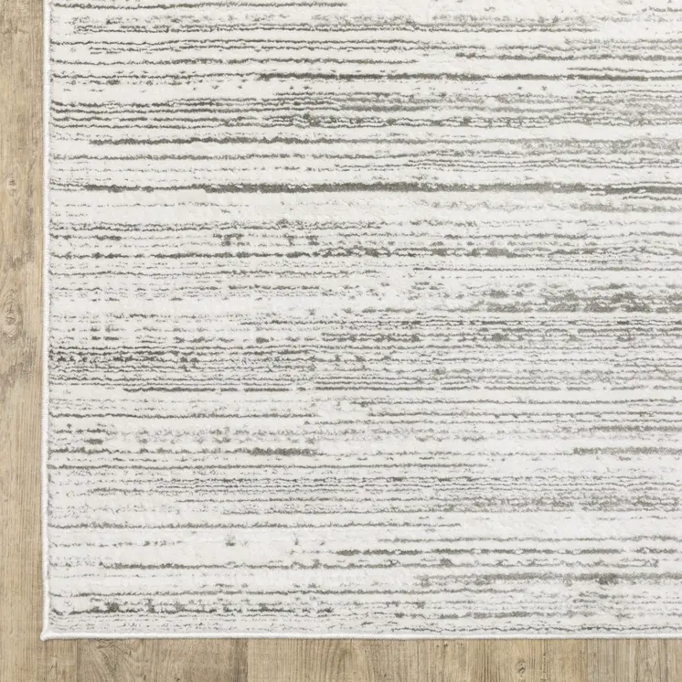 7' X 10' White And Gray Abstract Distressed Area Rug