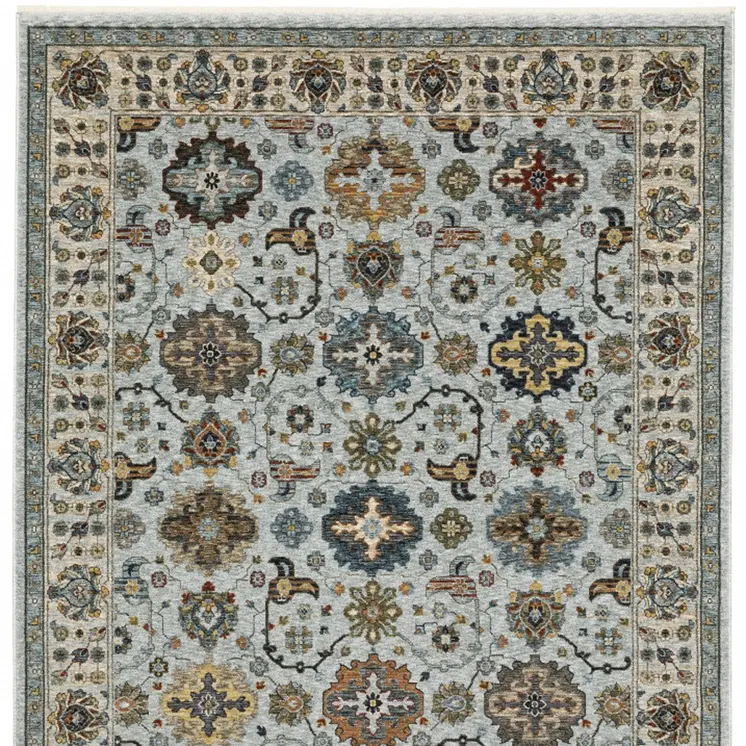 3' X 5' Blue Beige Grey Green Yellow And Rust Oriental Power Loom Stain Resistant Area Rug With Fringe