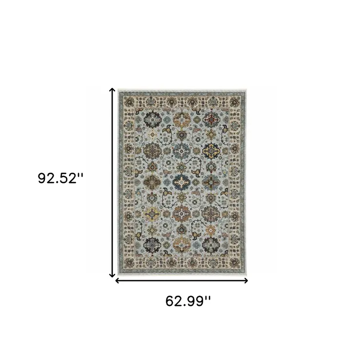 5' X 8' Blue Beige Grey Green Yellow And Rust Oriental Power Loom Stain Resistant Area Rug With Fringe