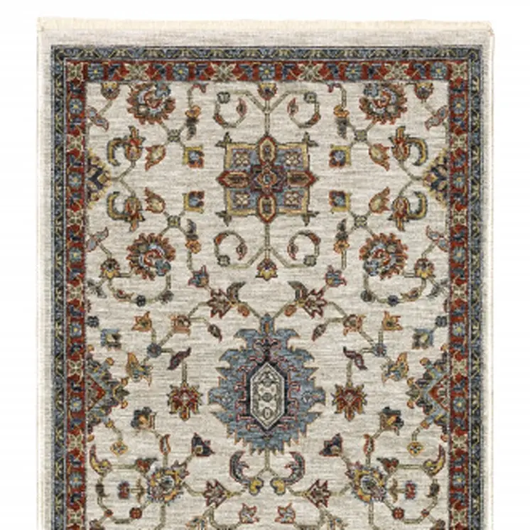 2' X 8' Beige Rust Red Blue Gold And Grey Oriental Power Loom Stain Resistant Runner Rug With Fringe