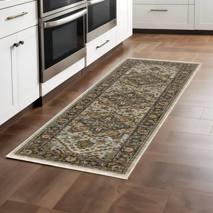 2' X 8' Ivory Beige Blue Orange Gold Green Grey And Rust Oriental Power Loom Stain Resistant Runner Rug With Fringe