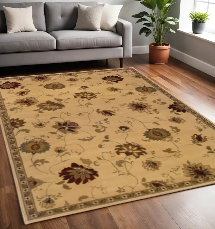 5' X 8' Ivory Green Brown Blue And Rust Floral Power Loom Stain Resistant Area Rug