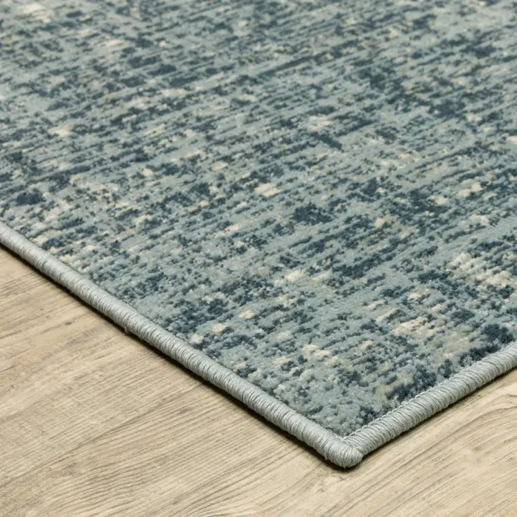 7' X 9' Blue And Beige Abstract Area Rug