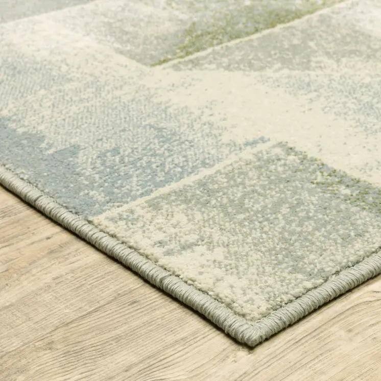 7' X 9' Gray And Ivory Geometric Area Rug