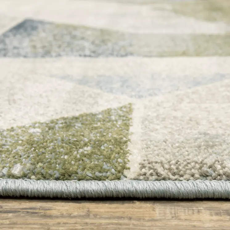 7' X 9' Gray And Ivory Geometric Area Rug